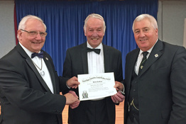 Bro. Jimmy Stewart P.M. is presented with his Jubilee Certificate